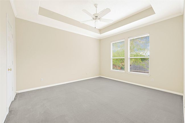 Bedroom with view to back patio. | Image 38