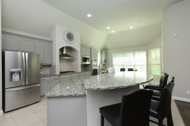Light white and gray with black accents quartz counters | Image 24