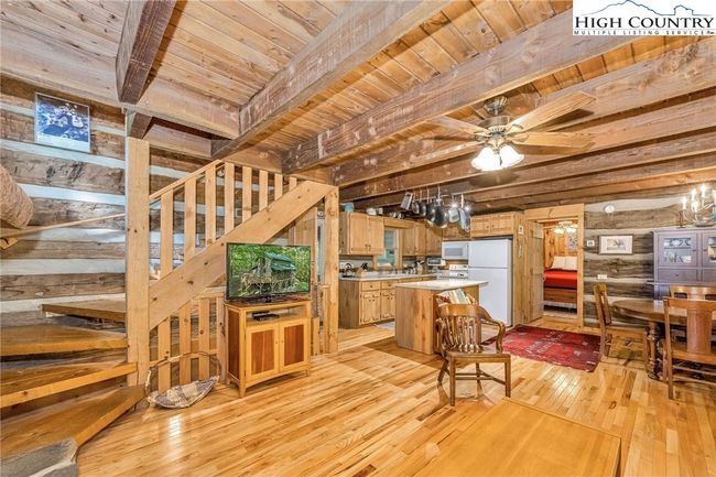 Hand hewn stairs lead the way to the upper level. | Image 16