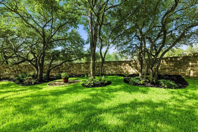 View of fenced backyard | Image 33