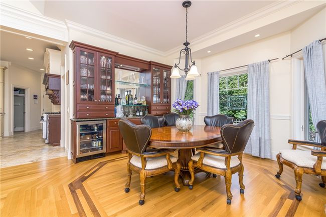Notice the detail on the gleaming hardwood floors and the built in cabinet and wine refrigerator. | Image 15