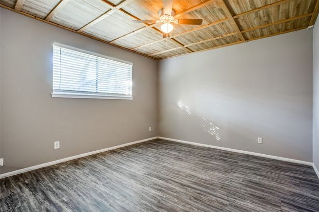 Empty room featuring baseboards, ceiling fan, and wood finished floors | Image 19
