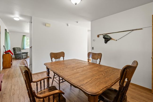 Dining area with light wood-style floors and baseboards | Image 15