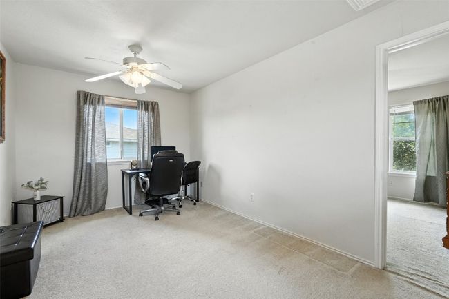 Office space featuring light colored carpet and ceiling fan | Image 16