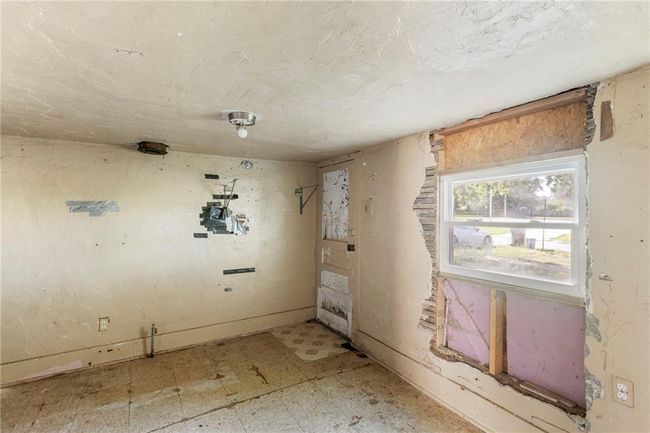Spare room featuring tile patterned floors | Image 17