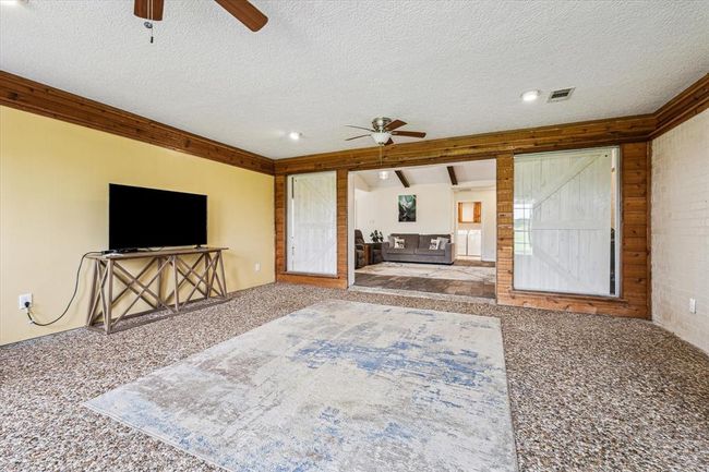 Another view of the sunroom looking towards the main living area | Image 23