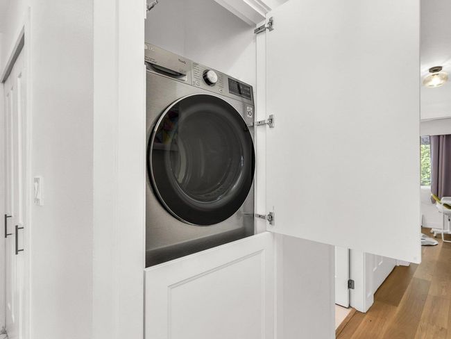 Laundry area with washer / clothes dryer and wood finished floors | Image 15