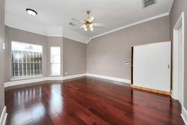 Master bedroom with wood floor | Image 18
