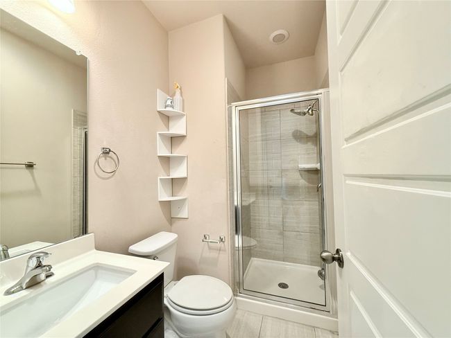 Bathroom featuring vanity and a stall shower | Image 26