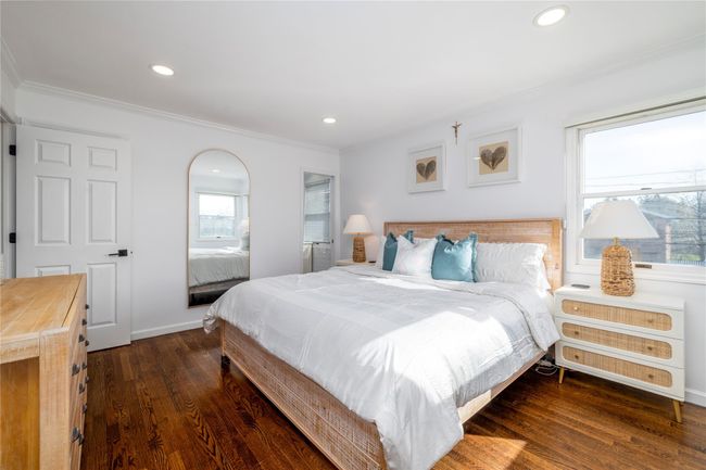 Bedroom with recessed lighting, ornamental molding, and wood finished floors | Image 19