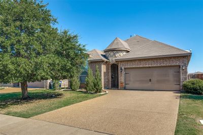 View of front of house featuring a front yard and a garage | Image 2