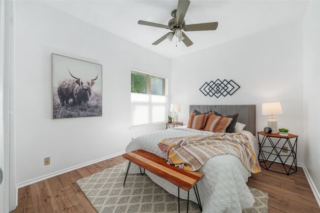 Bedroom featuring wood finished floors and ceiling fan | Image 19