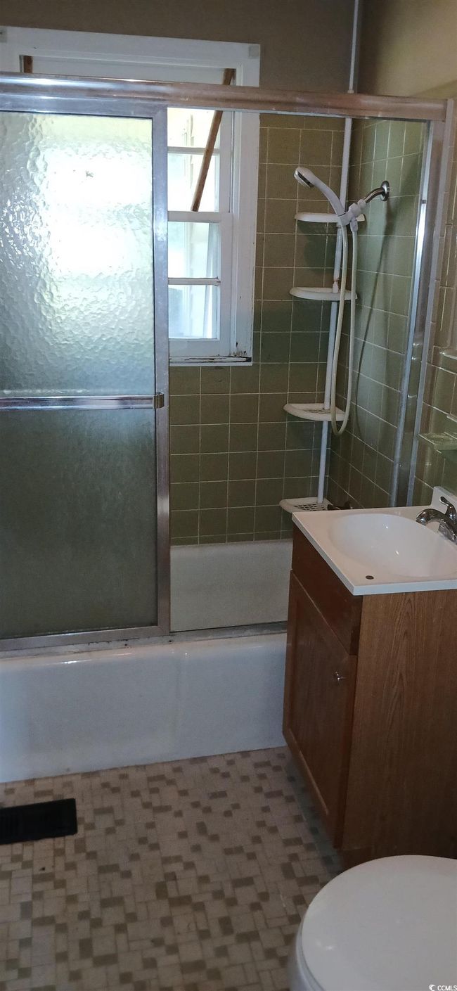 Full bath with vanity and bath / shower combo with glass door | Image 28