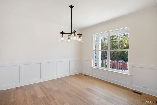 Photo represents the plan, not the actual home. Design selections may vary. The first floor offers open-concept living, featuring a formal dining and living room directly off of the foyer. | Image 5