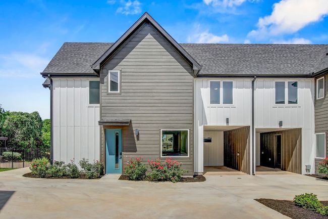 View of front of home featuring board and batten siding and a shingled roof | Image 27