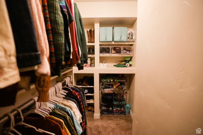 Walk in closet with carpet floors | Image 28