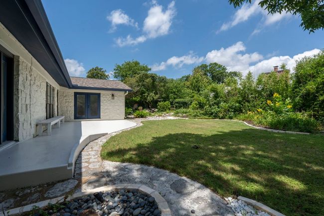 View of grassy yard with french doors | Image 30