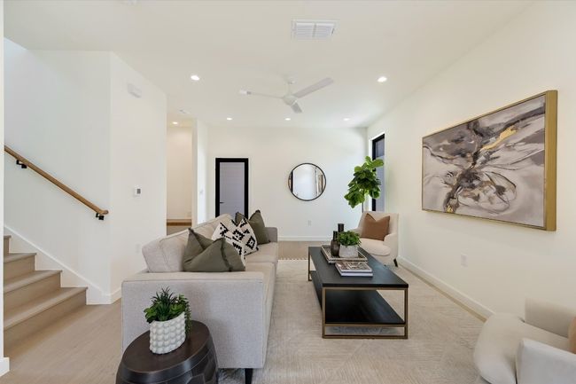 Living area featuring recessed lighting, a ceiling fan, and stairs | Image 8