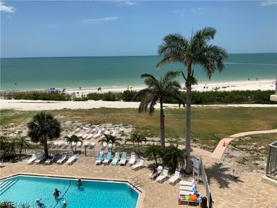 View of pool and beach , from condo balcony now | Image 1