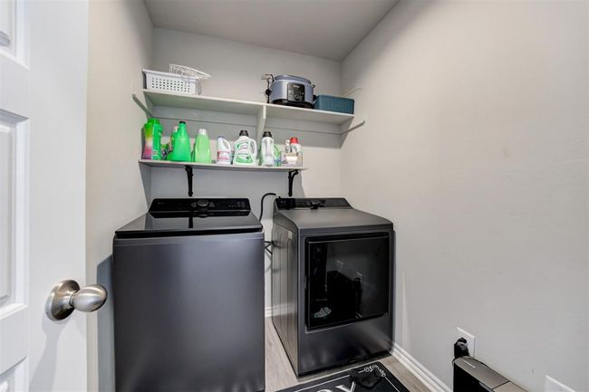 Washroom with washing machine and clothes dryer | Image 37
