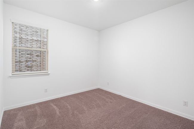 Spare room featuring carpet flooring and baseboards | Image 17