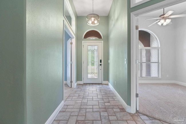 7008 Turnberry Cir, House other with 4 bedrooms, 2 bathrooms and 3 parking in Navarre FL | Image 8