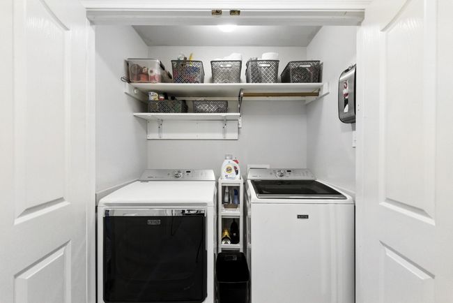 Laundry area with washer and clothes dryer | Image 27