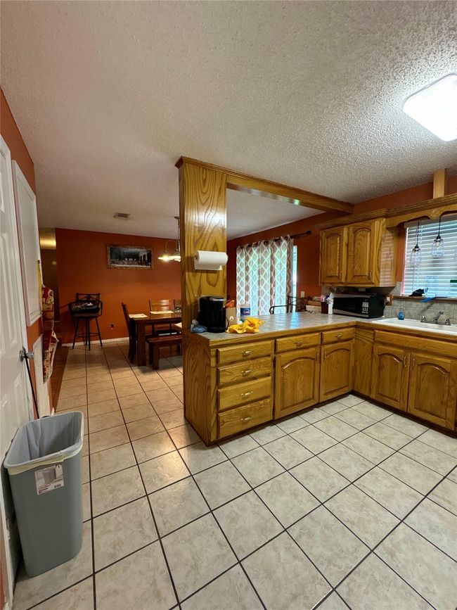 Kitchen from the dining room with plenty of cooking space | Image 16