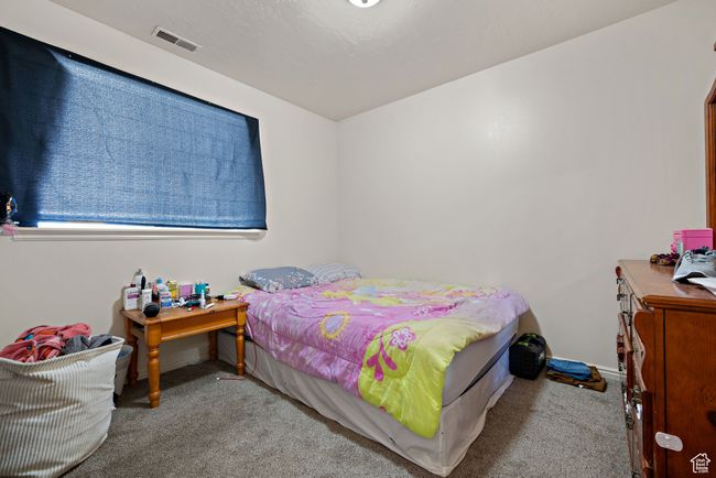 Bedroom featuring carpet floors and baseboards | Image 18