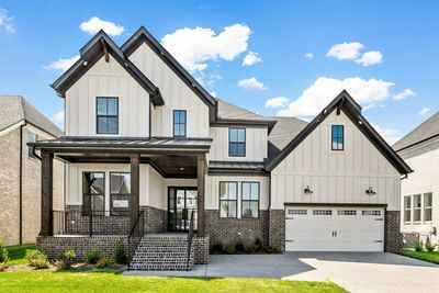 Home is Move In Ready! Lovely front porch welcomes you to this Marshall plan with so many additional options! | Image 1