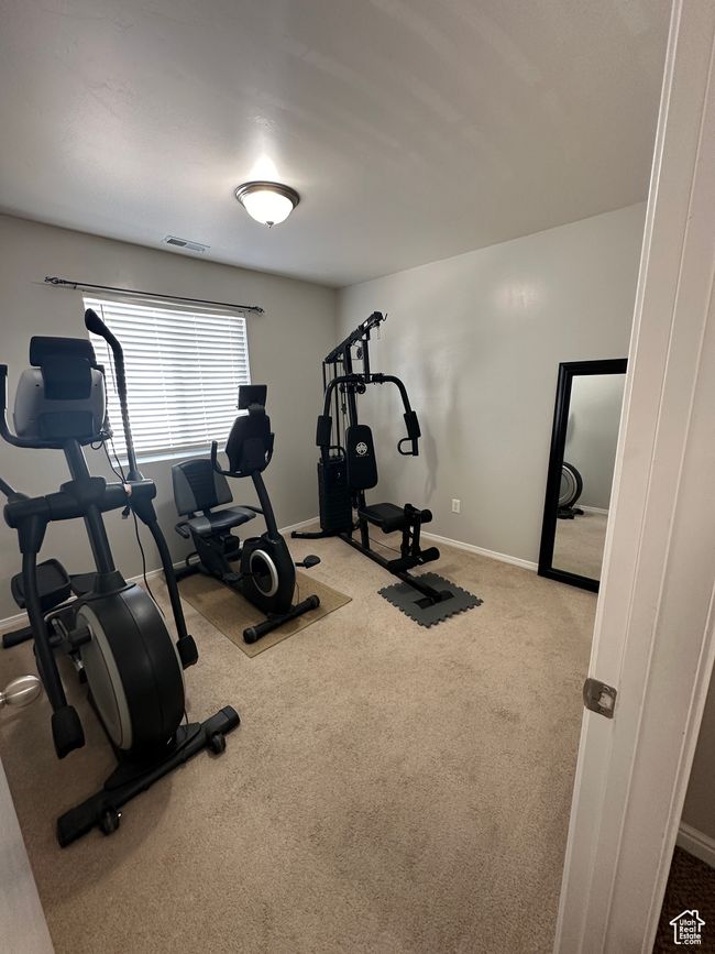 Workout room featuring carpet floors, visible vents, and baseboards | Image 19