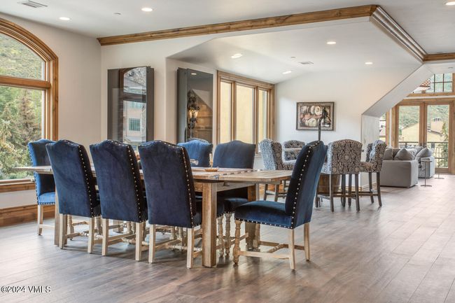 Host with ease in this elegant dining area, perfectly positioned between the kitchen and great room. With seating for ten and views of Vail Village, it’s designed for memorable meals and après-ski game nights alike. | Image 4