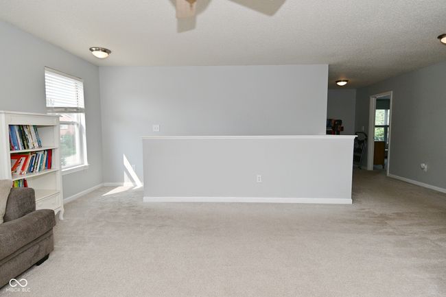 carpeted spare room with a ceiling fan and baseboards | Image 30