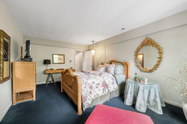 Carpeted bedroom featuring baseboards | Image 8