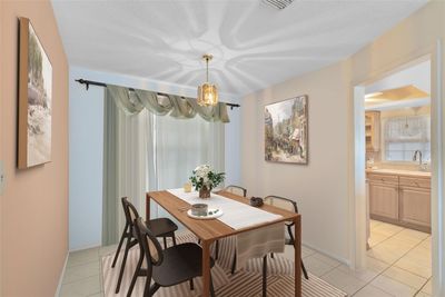 This photo has been virtually staged. The dinette space is conveniently located just off the kitchen. | Image 3