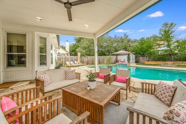 Fenced backyard featuring an outdoor hangout area and a patio area | Image 27