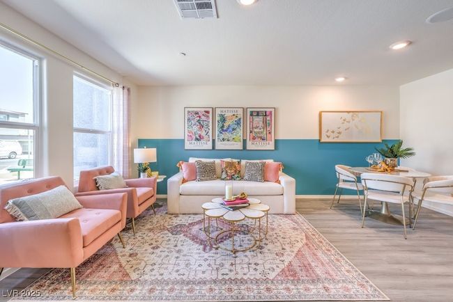 Living room featuring wood finished floors, visible vents, recessed lighting, and baseboards | Image 8