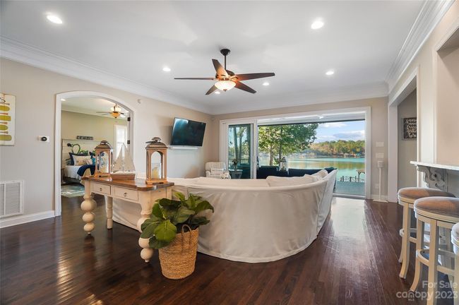 Open great room with sliding glass doors to covered patio extends the living space to the great outdoors! | Image 7
