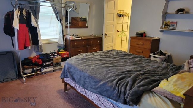 Carpeted bedroom featuring a closet | Image 11
