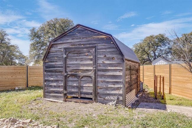 View of shed featuring a fenced backyard | Image 28