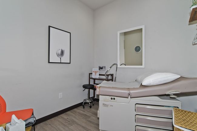 Home office with wood finished floors and baseboards | Image 10