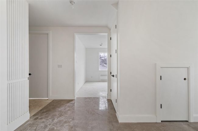 Hallway featuring baseboards | Image 7