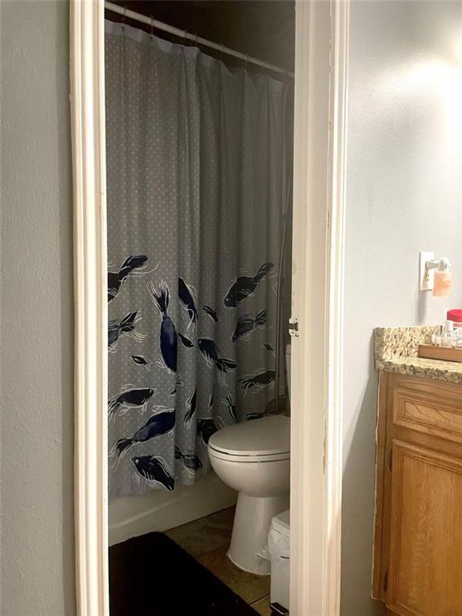 Full bath with toilet, vanity, and a shower with curtain | Image 6