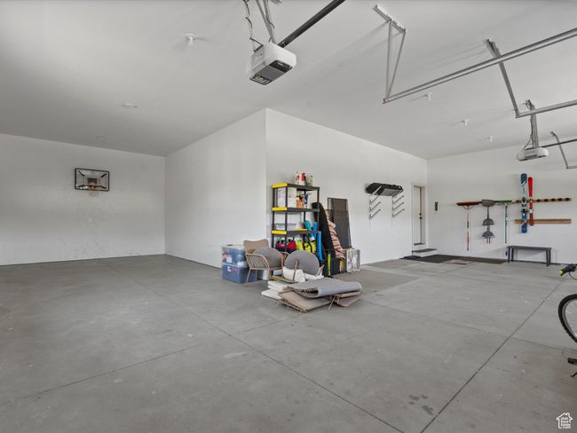 Garage with a garage door opener | Image 53
