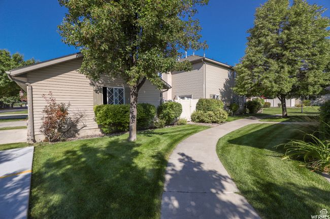 View of side of home featuring a yard | Image 43