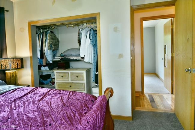 Carpeted bedroom featuring a closet and baseboards | Image 33