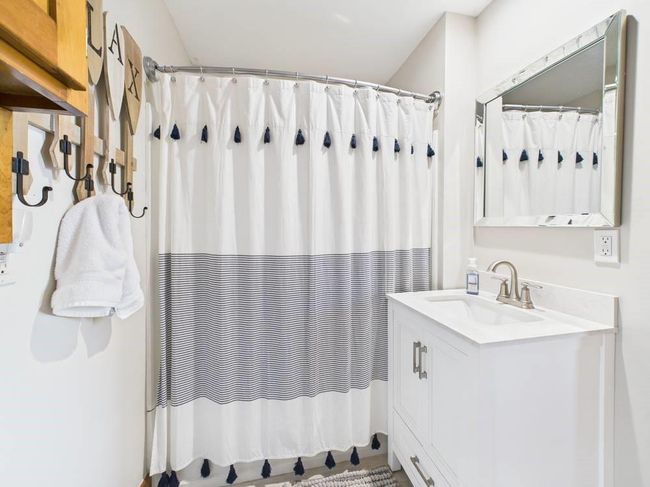 Full bath featuring vanity and curtained shower | Image 44