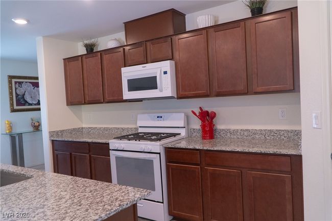 Kitchen with white appliances and recessed lighting | Image 22