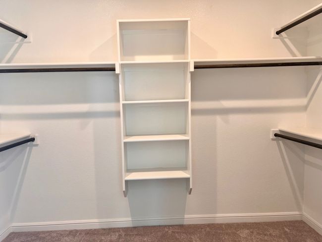 Walk in closet featuring carpet floors | Image 15