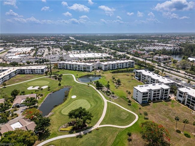 Aerial view of apartment complex / building and a nearby body of water | Image 33